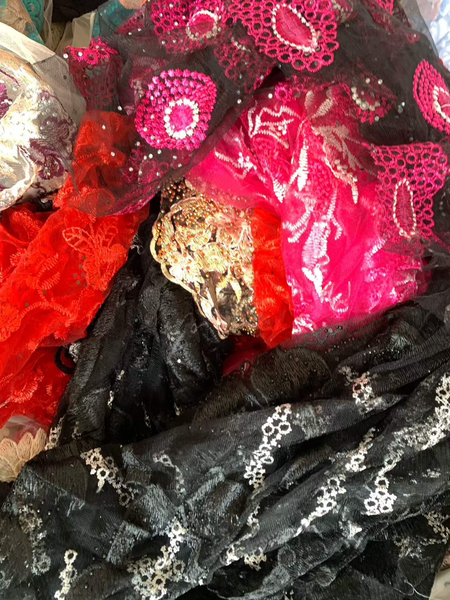 Embroidered glass tulle fabric remnants with pink and red lace patterns for wedding dresses