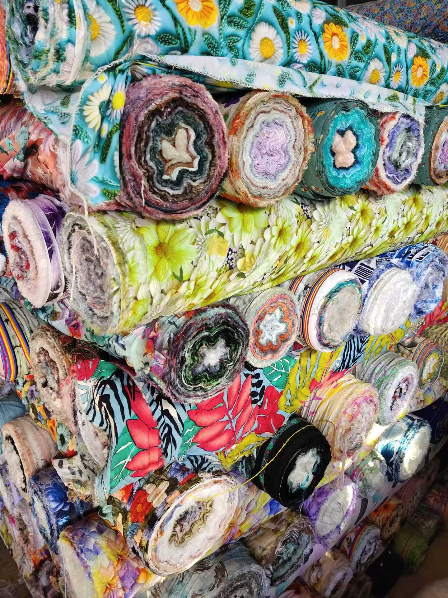 Assorted digital print rayon fabric rolls, lightweight for summer bedding
Colorful cotton silk fabric bundles with mixed floral patterns, sold by the kg