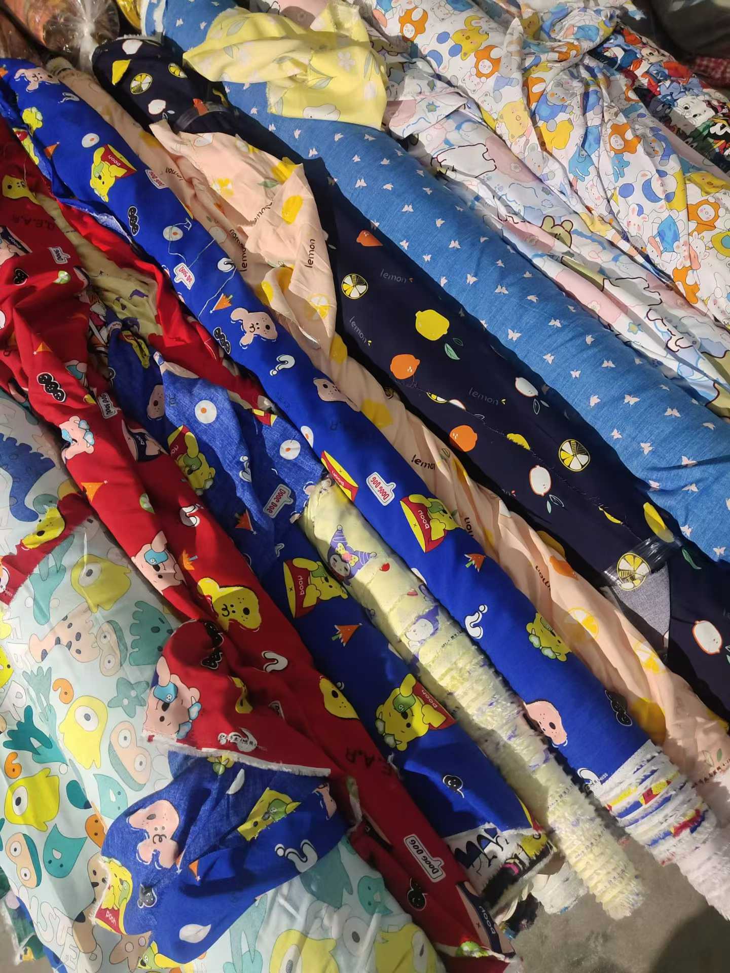 Cartoon Printed Cotton Poplin Fabric Wholesale | Kids Apparel Fabric Rolls Bulk Supplier Stock Lots