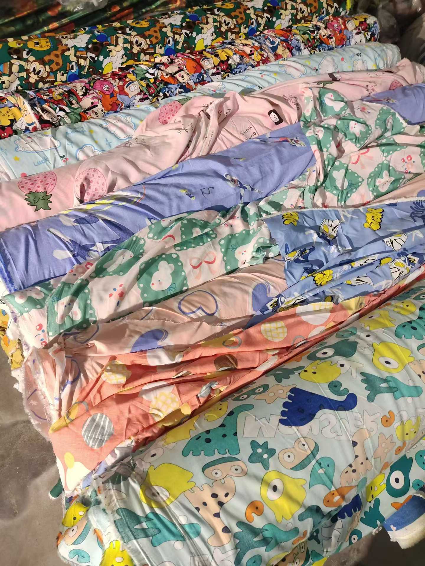 Cartoon Printed Cotton Poplin Fabric Wholesale | Kids Apparel Fabric Rolls Bulk Supplier Stock Lots