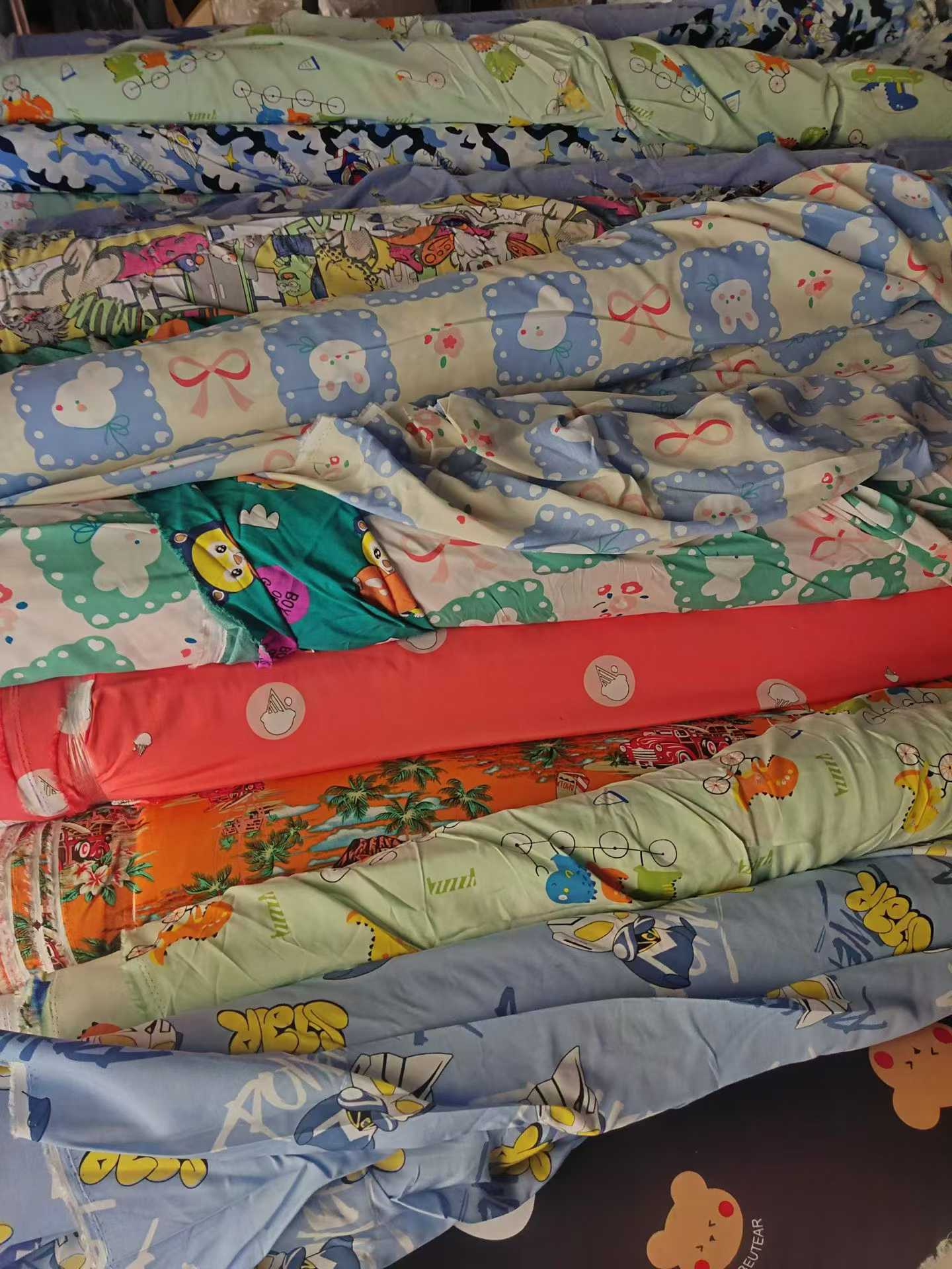 Cartoon Printed Cotton Poplin Fabric Wholesale | Kids Apparel Fabric Rolls Bulk Supplier Stock Lots