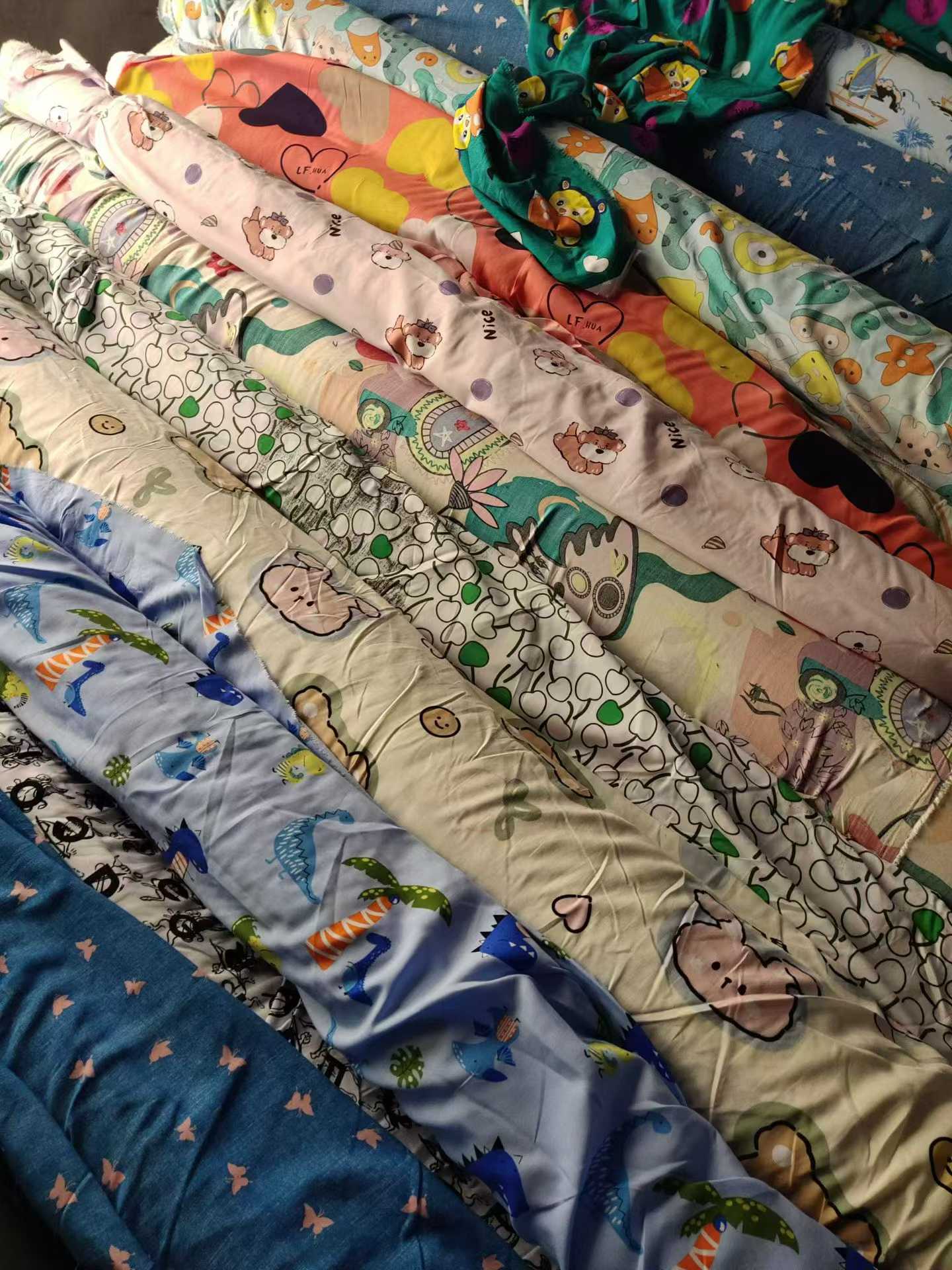 Cartoon Printed Cotton Poplin Fabric Wholesale | Kids Apparel Fabric Rolls Bulk Supplier Stock Lots